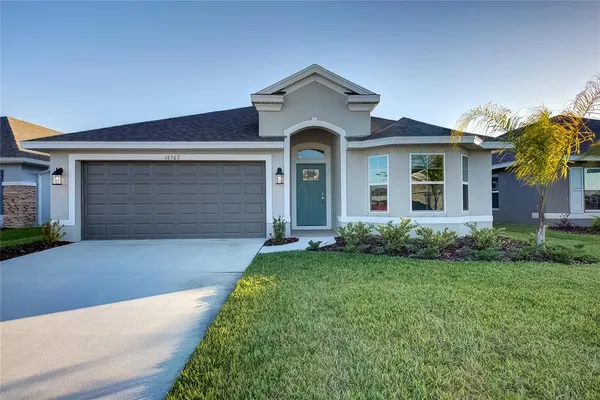 front view of a house with a yard