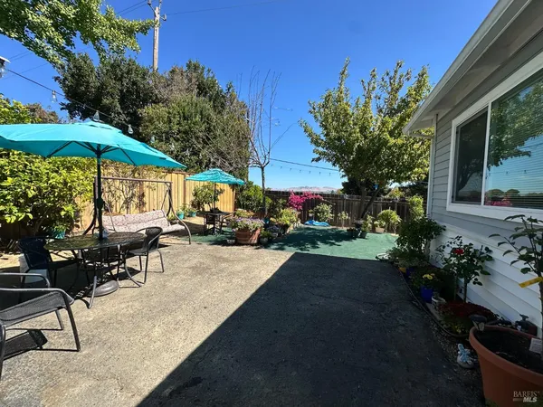 a view of a back yard from a room