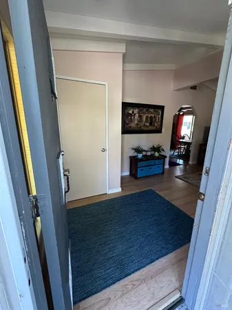 a view of living room with furniture and a flat screen tv