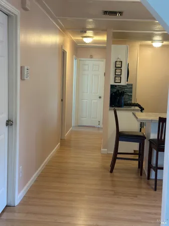 a room with furniture and wooden floor