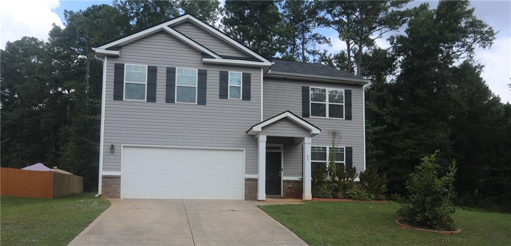 25 Lena Court Covington, GA 30016 - Photo 1 of 36 a front view of a house with a yard