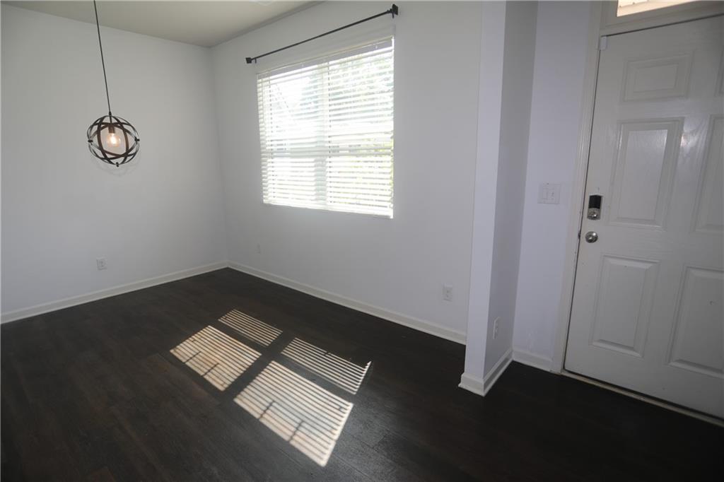 25 Lena Court Covington, GA 30016 - Photo 3 of 36 a view of wooden floor and windows in a room