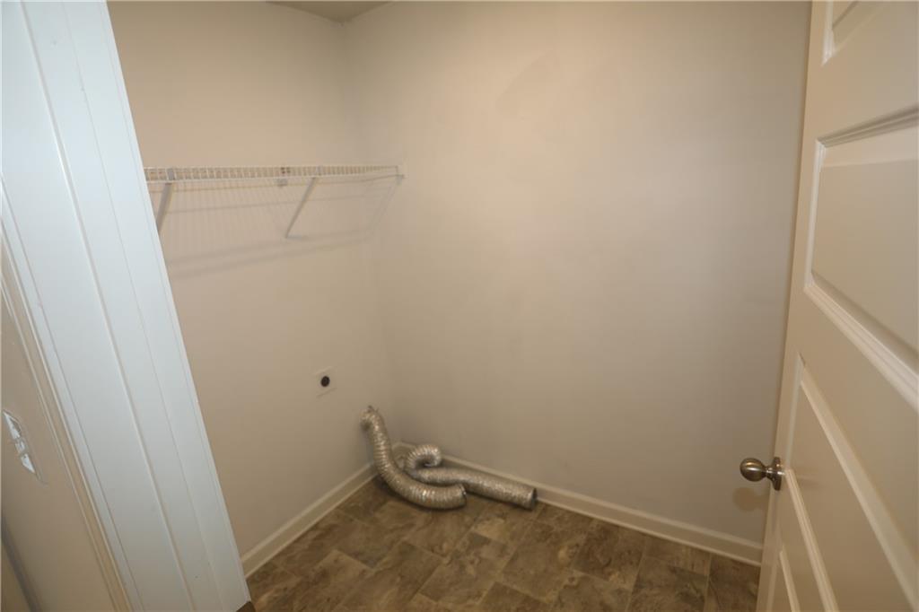 25 Lena Court Covington, GA 30016 - Photo 31 of 36 a view of a room with rack on the wall