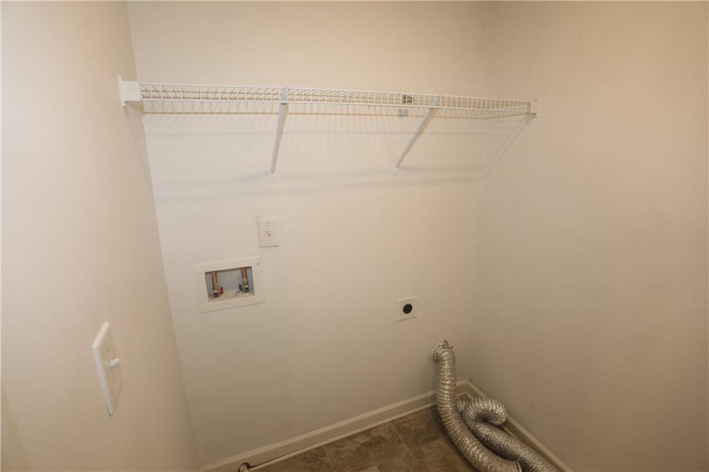 25 Lena Court Covington, GA 30016 - Photo 32 of 36 a view of a room with racks on the wall