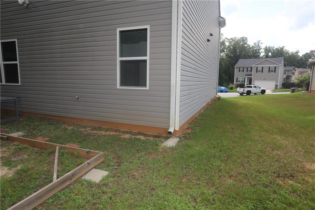 25 Lena Court Covington, GA 30016 - Photo 36 of 36 a view of a house with a backyard
