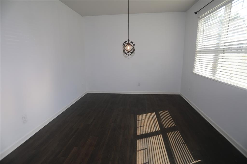 25 Lena Court Covington, GA 30016 - Photo 4 of 36 a view of wooden floor in an empty room