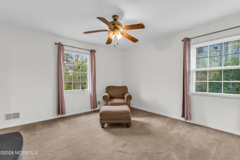 a living room with furniture and window