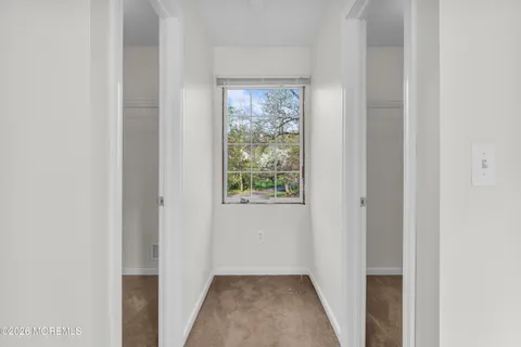 a view of a hallway with a window