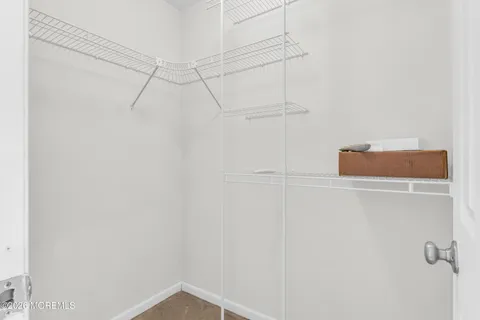 a room with a fan and a window