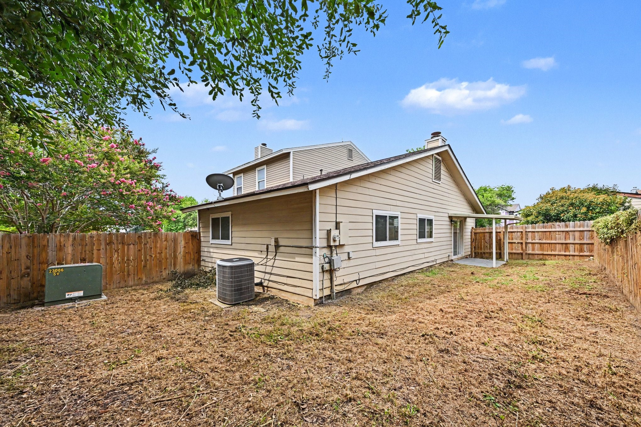 8406 Forest Ridge Drive San Antonio, TX 78239 - Photo 30 of 33 a view of a backyard with wooden fence and large trees