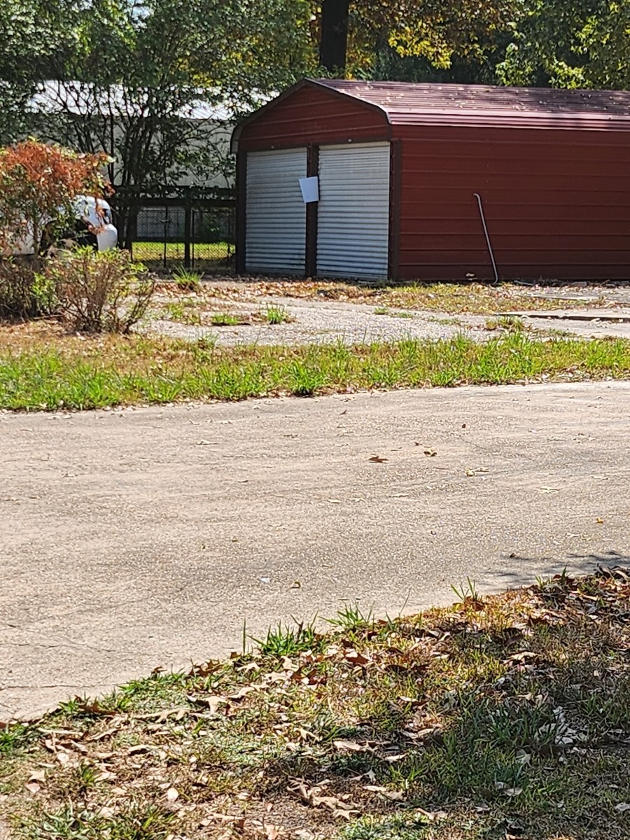 26002 Roping Pen Road Splendora, TX 77372 - Photo 4 of 7 a couple of tennis court with a house in background