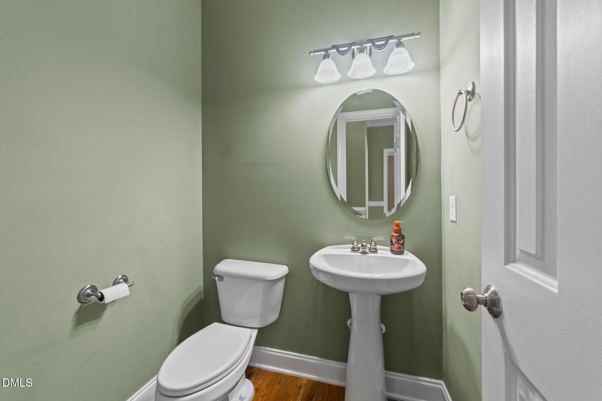 83 Larson Court Clayton, NC 27520 - Photo 13 of 35 a bathroom with a toilet sink and mirror