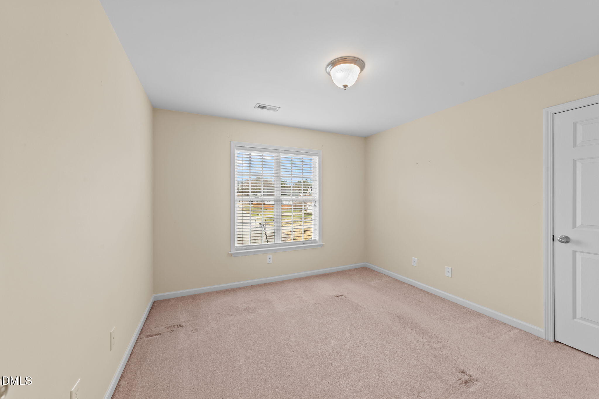 83 Larson Court Clayton, NC 27520 - Photo 17 of 35 an empty room with a window
