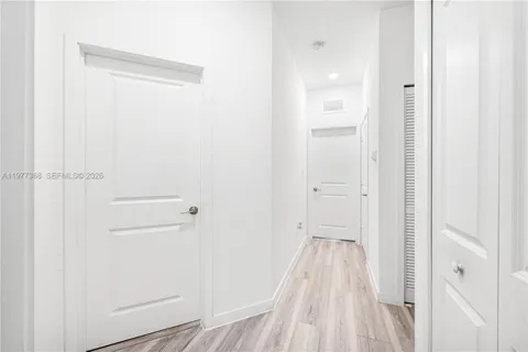 a kitchen with stainless steel appliances kitchen island granite countertop a refrigerator and a stove