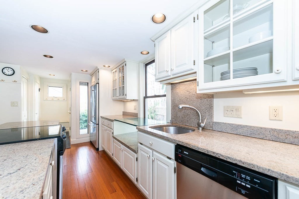 4 Jackson Court Lexington, MA 02421 - Photo 11 of 29 a kitchen with granite countertop a sink appliances cabinets and wooden floor