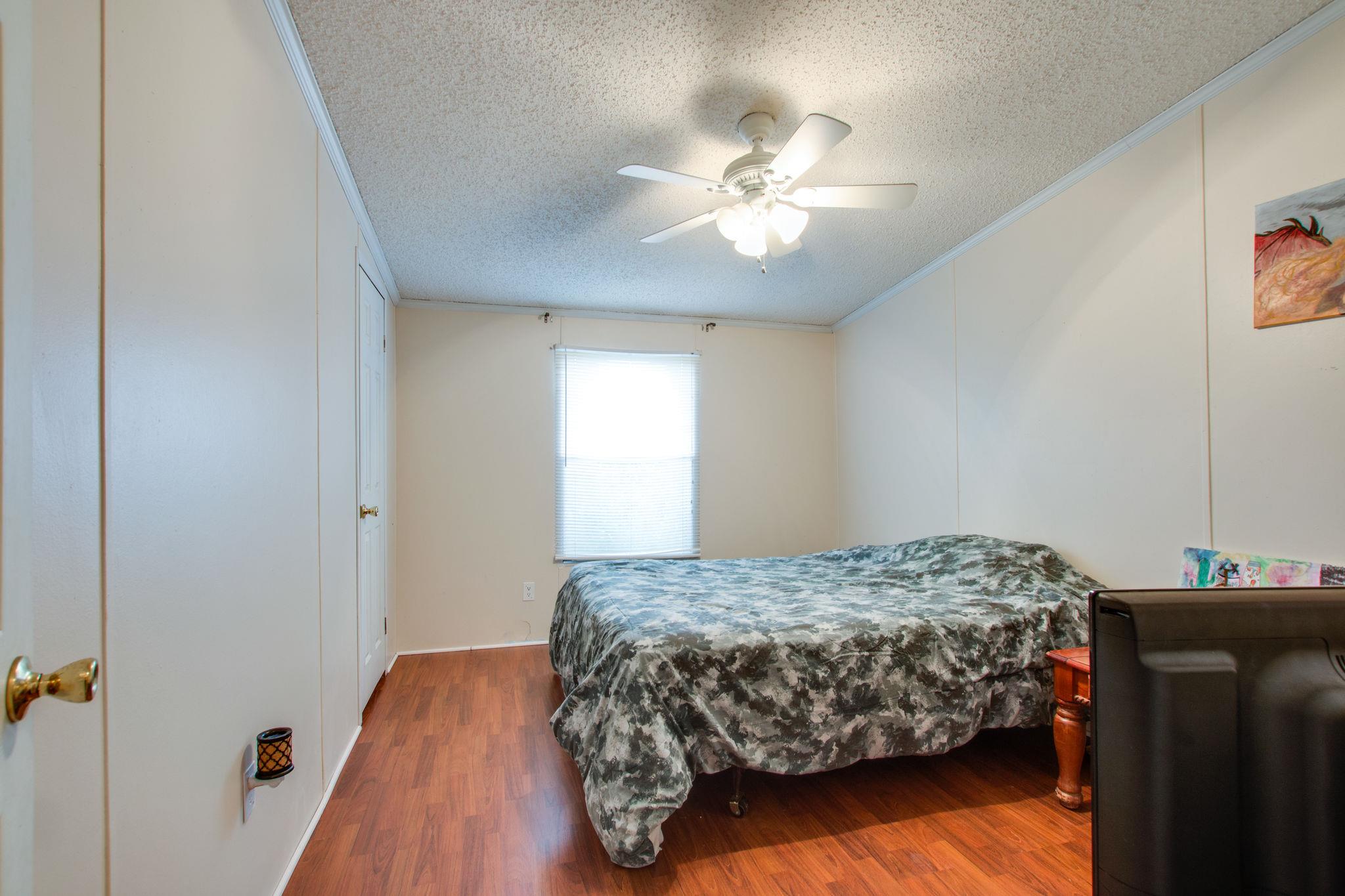 3240 Beasleys Bend Road Lebanon, TN 37087 - Photo 14 of 25 a bedroom with a bed and wooden floor