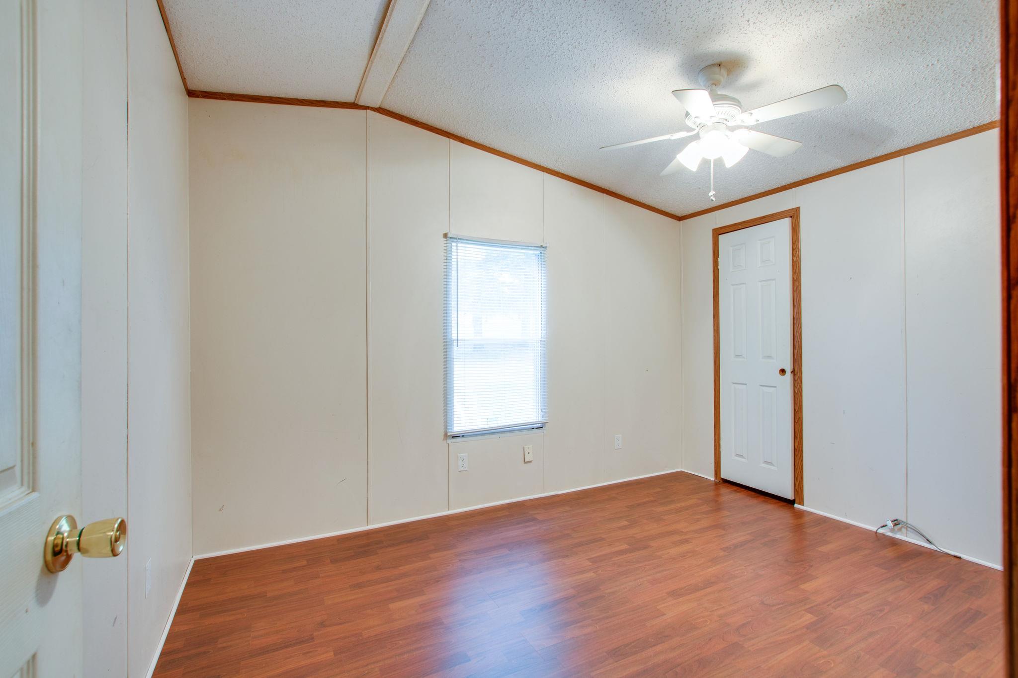 3240 Beasleys Bend Road Lebanon, TN 37087 - Photo 16 of 25 a view of an empty room with a chandelier fan