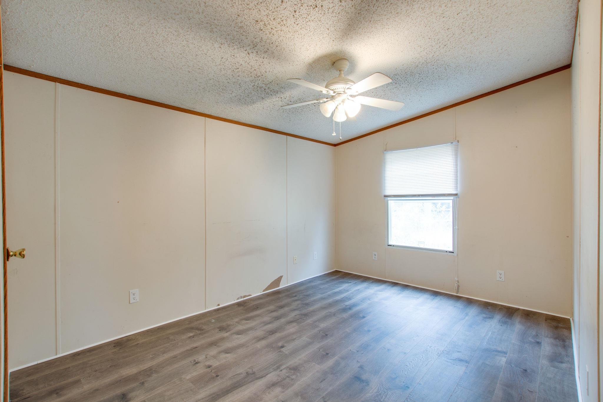 3240 Beasleys Bend Road Lebanon, TN 37087 - Photo 18 of 25 a view of an empty room with a window and wooden floor