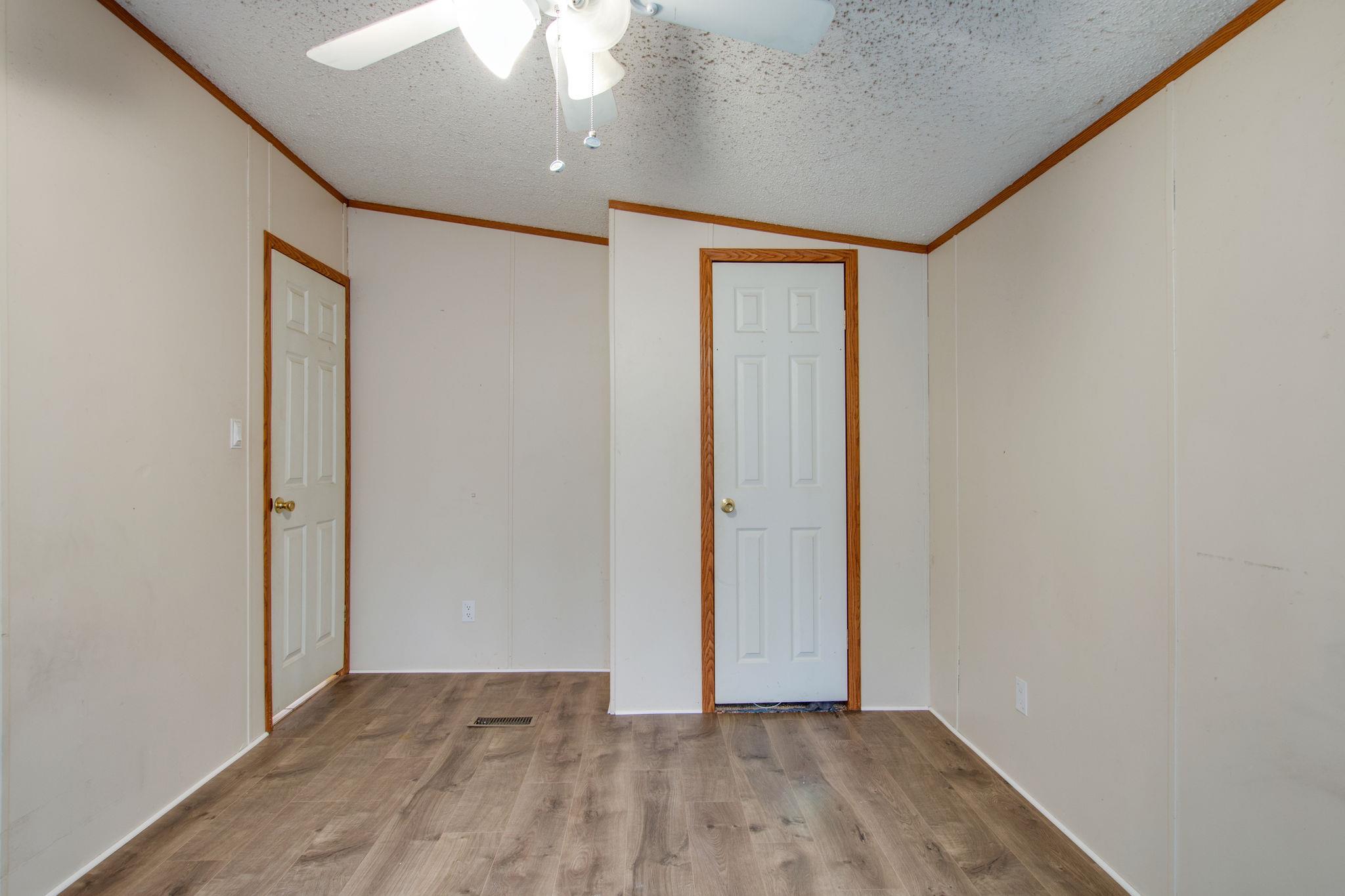 3240 Beasleys Bend Road Lebanon, TN 37087 - Photo 19 of 25 an empty room with wooden floor and a window