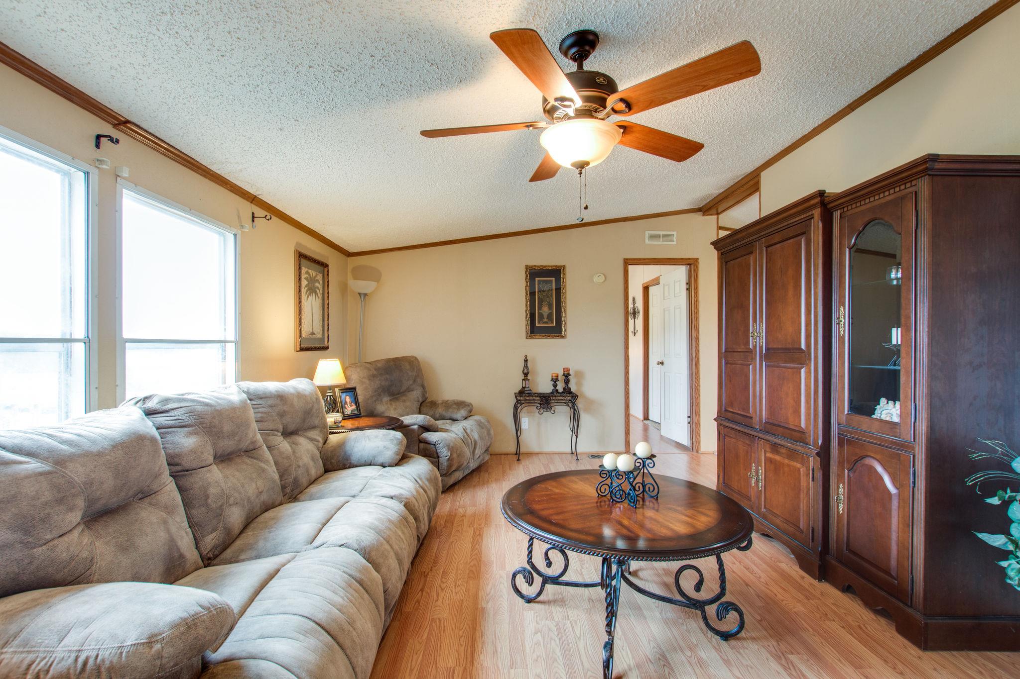 3240 Beasleys Bend Road Lebanon, TN 37087 - Photo 3 of 25 a living room with furniture a ceiling fan and a large window