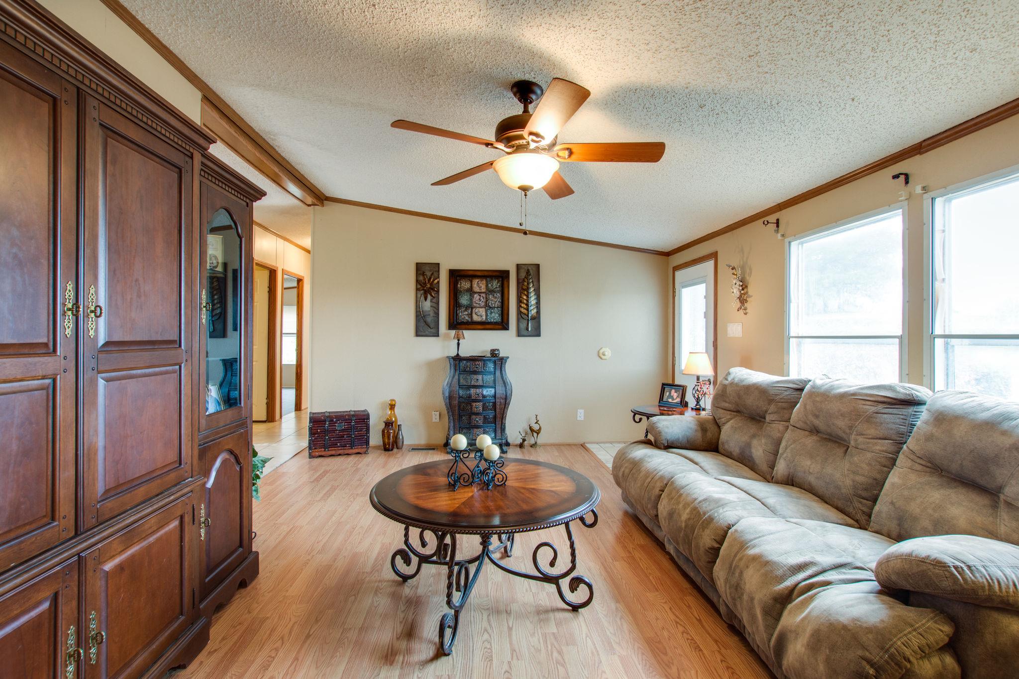 3240 Beasleys Bend Road Lebanon, TN 37087 - Photo 4 of 25 a living room with furniture a table and a large window