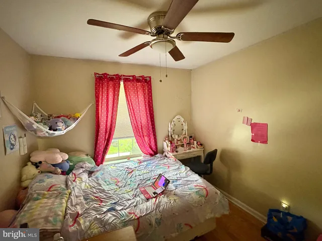 a bed room with a bed and a window