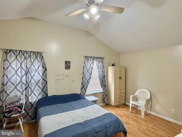 a bedroom with a bed and a chair