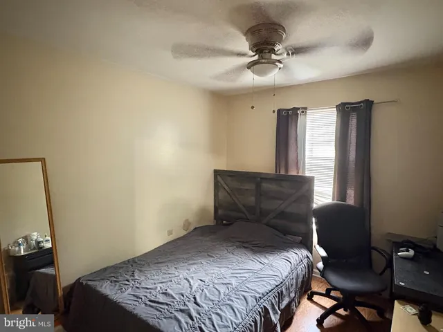 a bedroom with a bed and a table in it
