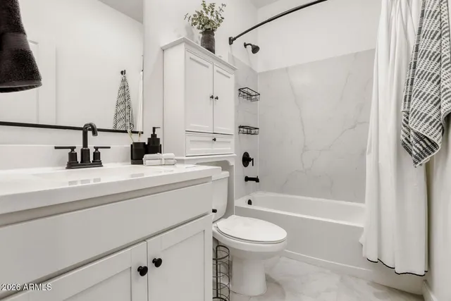 a bathroom with a sink a toilet and a bathtub
