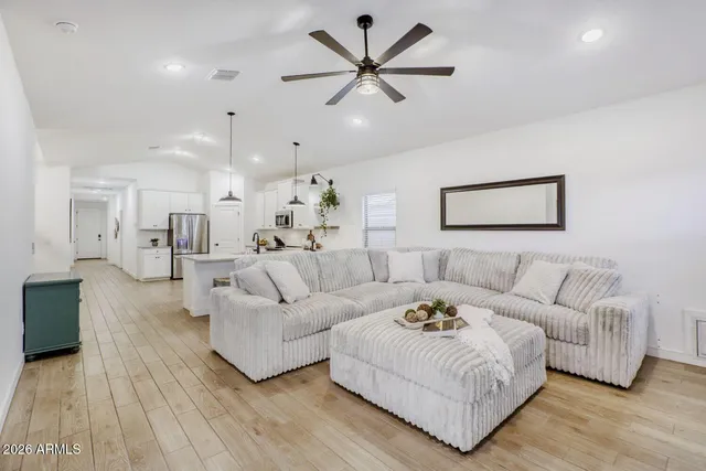 a living room with furniture and a large window