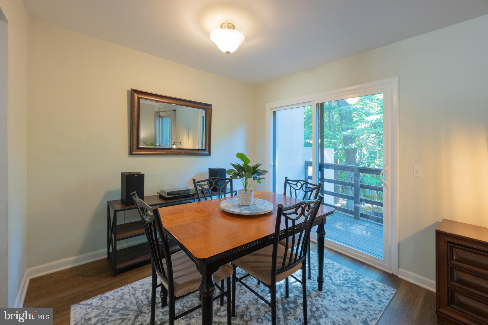 11917 Barrel Cooper Court Reston, VA 20191 - Photo 10 of 59 a view of a dining room with furniture window and wooden floor
