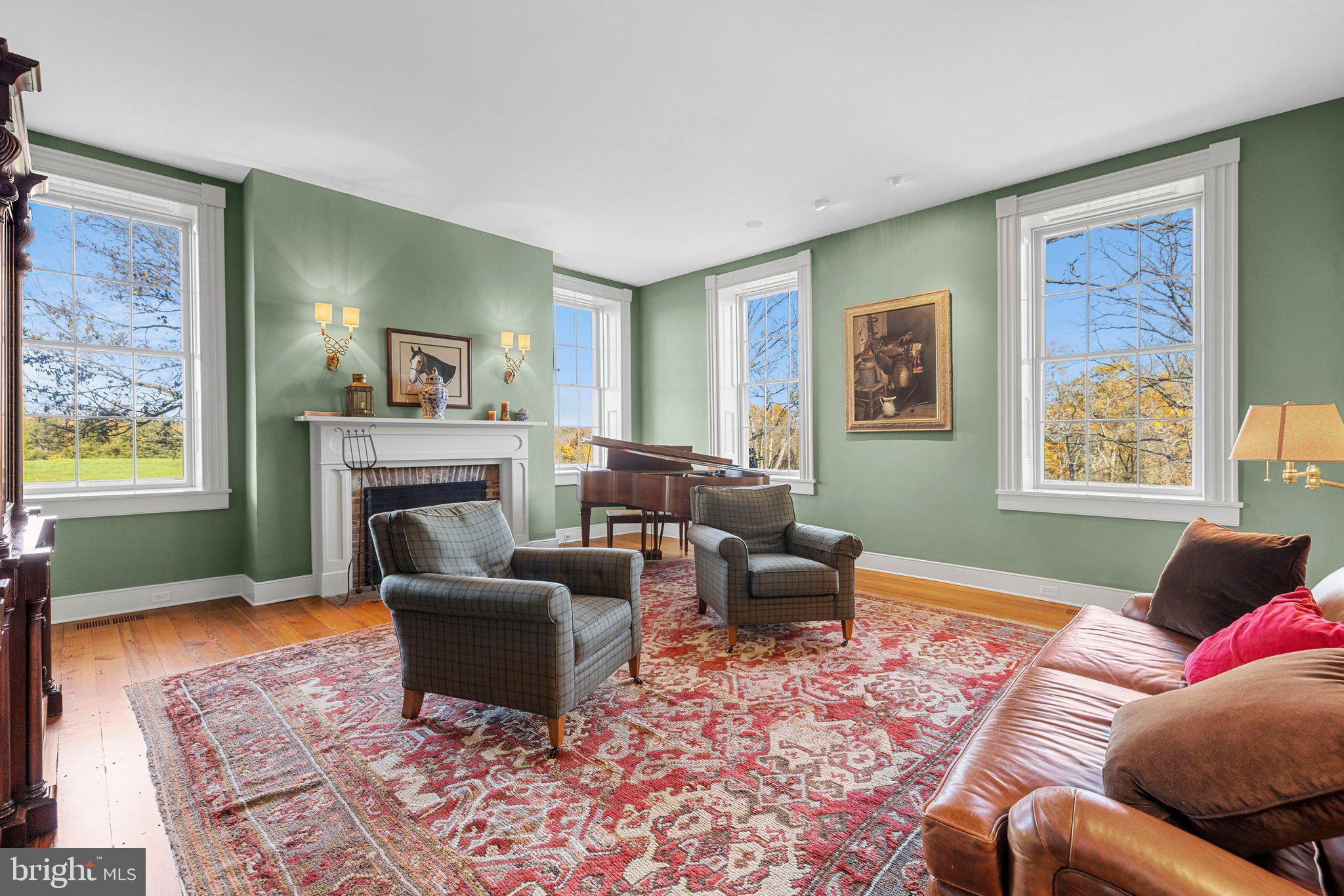 1077 Ginns Road Boyce, VA 22620 - Photo 11 of 140 a living room with furniture and a fireplace