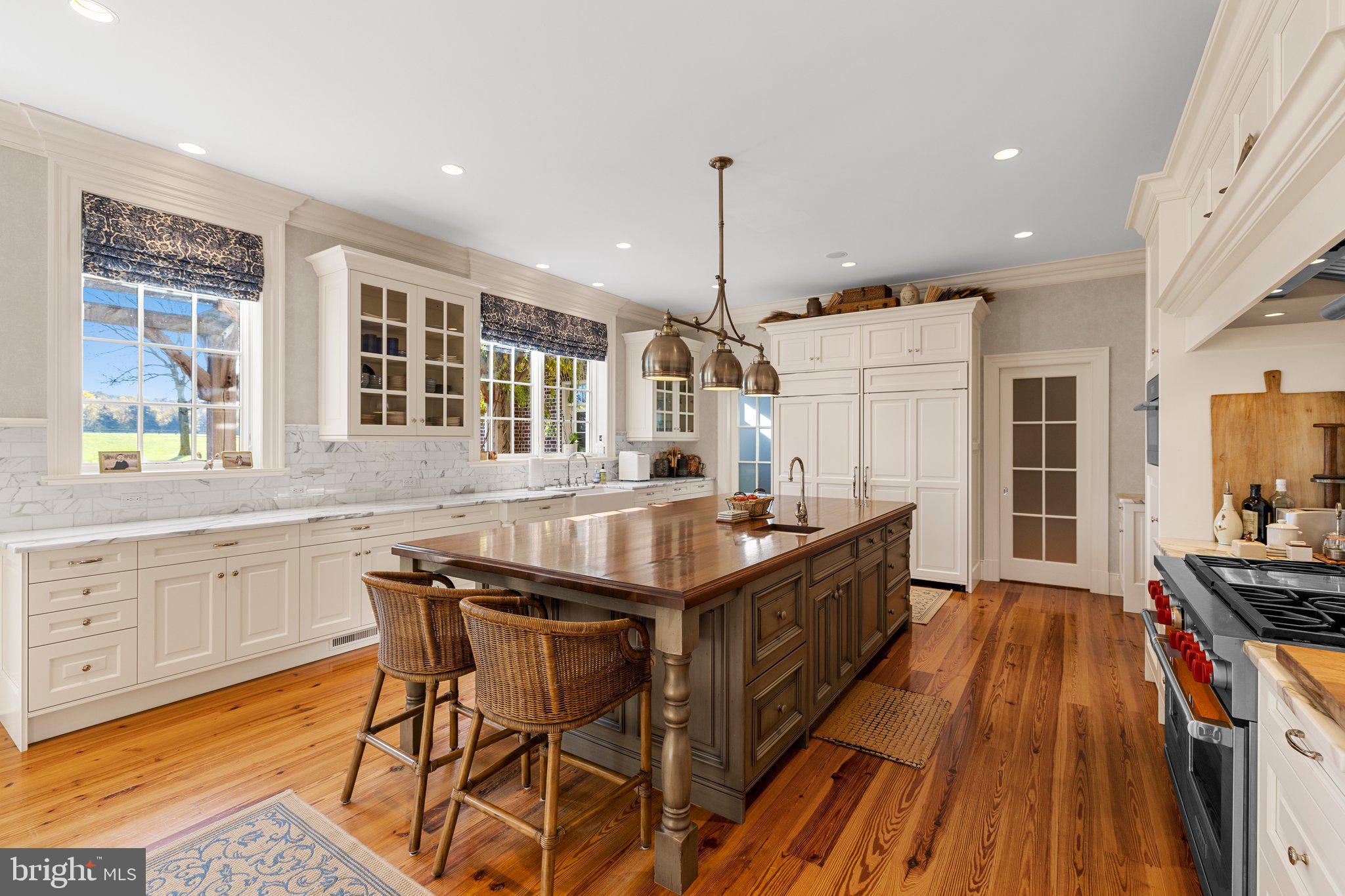 1077 Ginns Road Boyce, VA 22620 - Photo 22 of 140 a kitchen with stainless steel appliances granite countertop a stove a sink dishwasher and a refrigerator with wooden floor