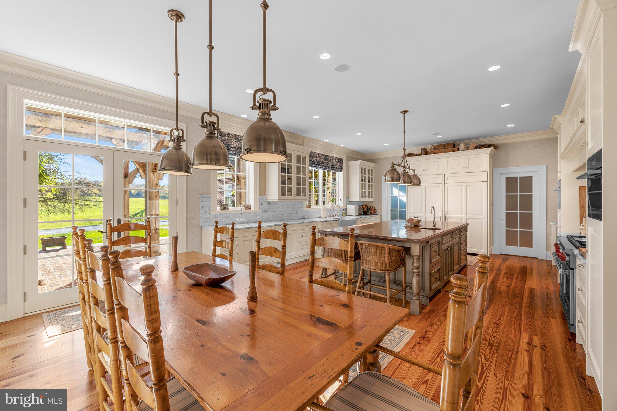 1077 Ginns Road Boyce, VA 22620 - Photo 28 of 140 a living room with lots of furniture and a chandelier