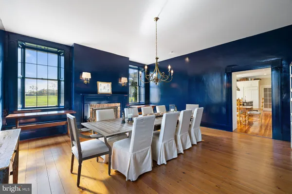 a spacious bathroom with a tub sink and mirror