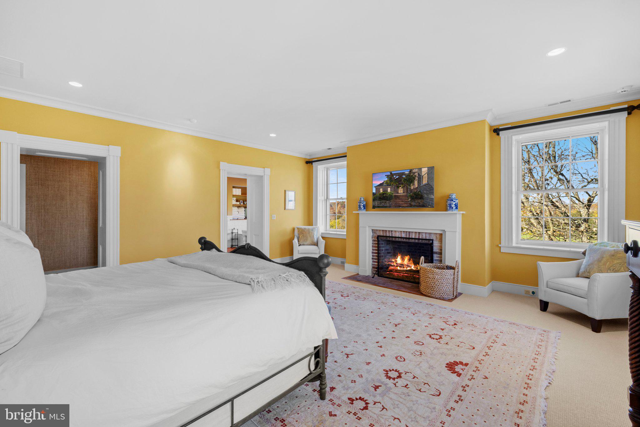 1077 Ginns Road Boyce, VA 22620 - Photo 57 of 140 a bedroom with a bed and a fireplace