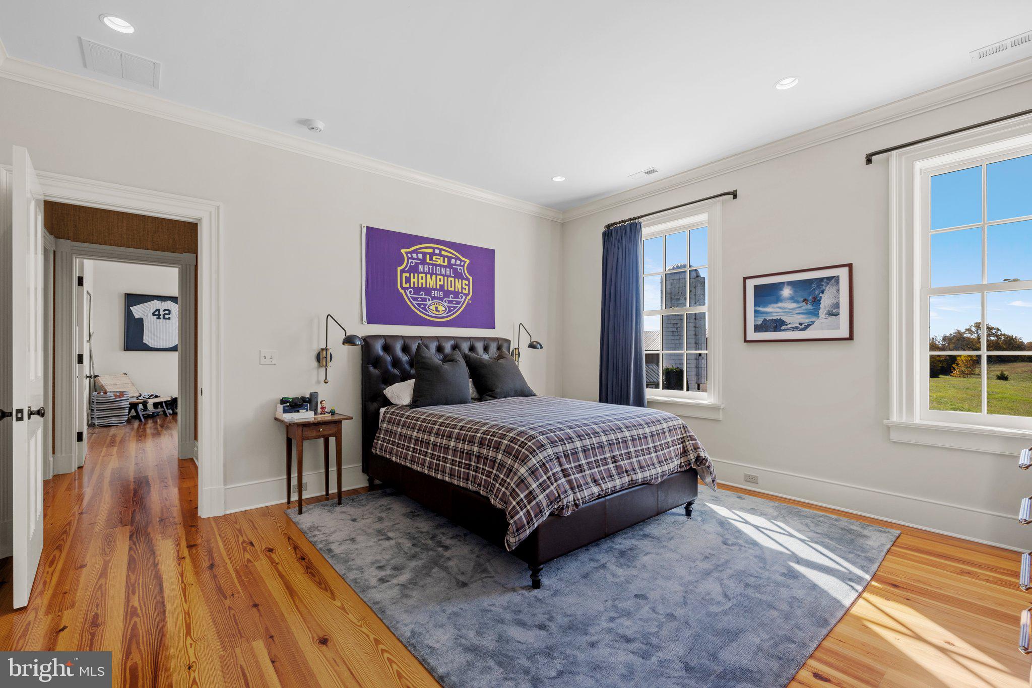 1077 Ginns Road Boyce, VA 22620 - Photo 82 of 140 a spacious bedroom with a bed and a table