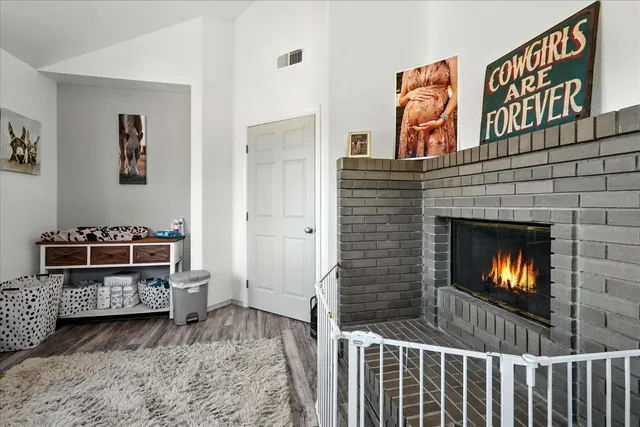 a bathroom with a granite countertop sink and a toilet