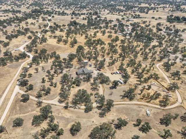 a view of a balcony with trees