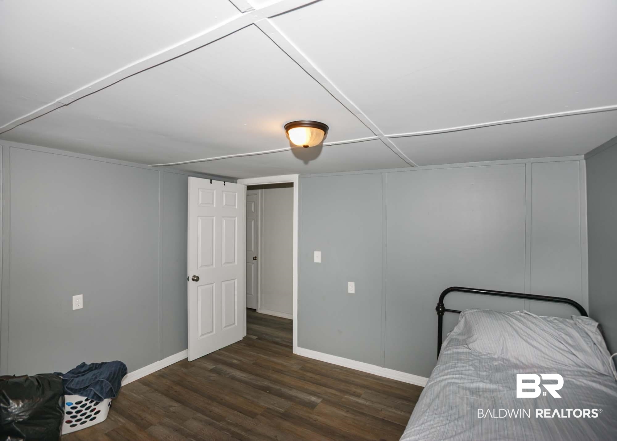 11998 Workman Avenue Foley, AL 36535 - Photo 22 of 59 Bedroom featuring baseboards and wood finished floors