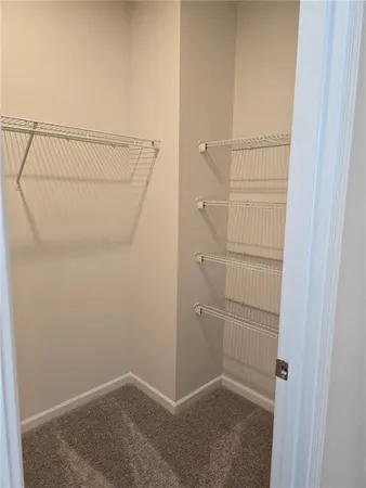 a bathroom with a double vanity sink and mirror
