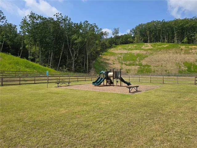 a view of a lake with a yard