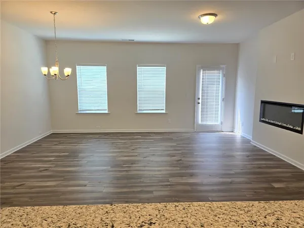 a view of a livingroom with wooden floor