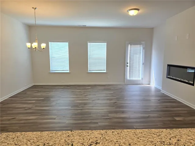 a view of a livingroom with wooden floor