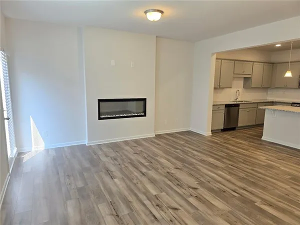a view of a kitchen with a sink and a stove