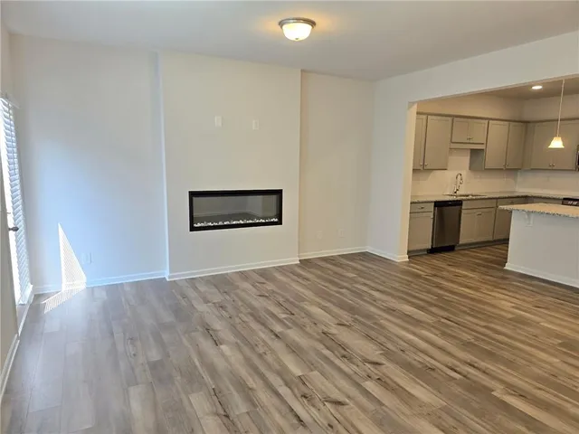 a view of a kitchen with a sink and a stove