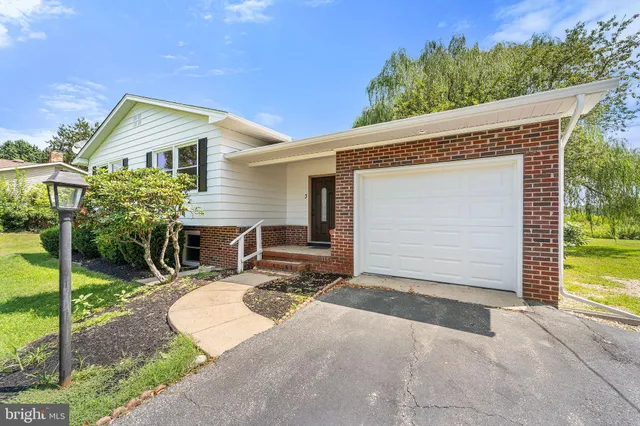 a backyard of a house with seating space