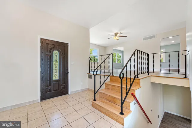 a view of a hallway with staircase