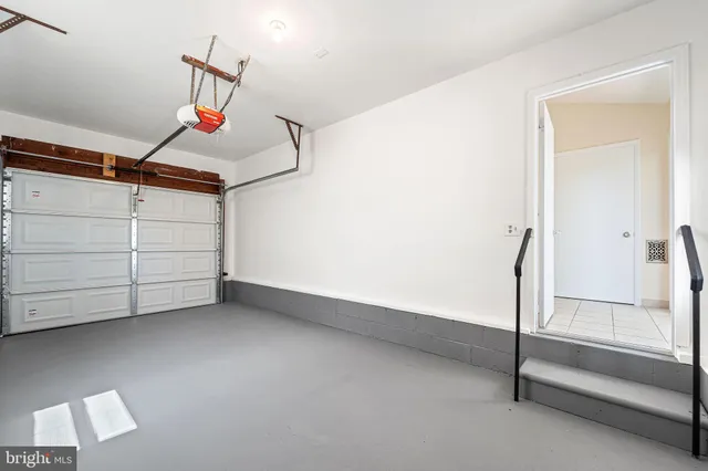 a view of empty room with cabinet and air conditioner