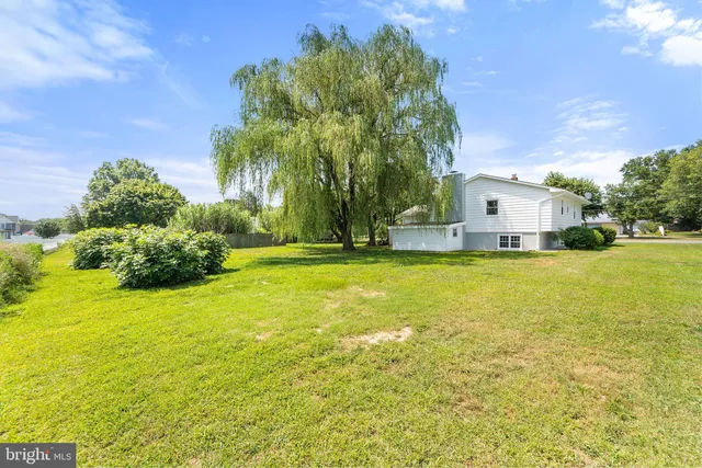 a view of a swimming pool with an outdoor space and seating area
